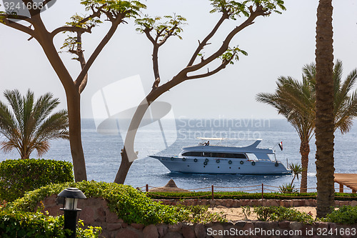 Image of Motor yacht and beach at the luxury hotel