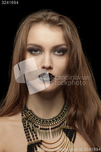 Image of Closeup portrait of a gothic young woman with black lips