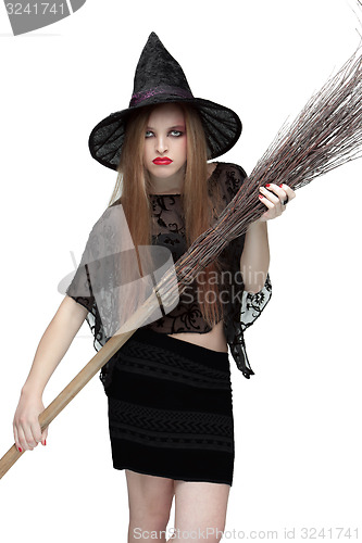 Image of Girl in witch costume with a broom. 2