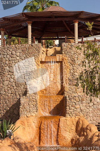 Image of  wooden gazebo with a waterfall, Egypt