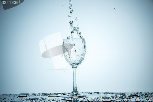 Image of glass being filled with water 