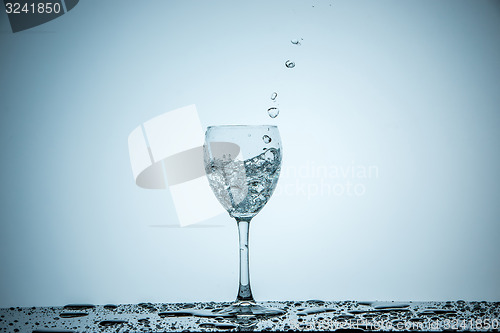 Image of glass being filled with water 