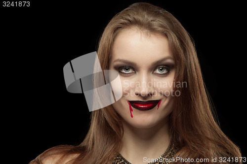 Image of Close-up portrait of a pale gothic vampire woman