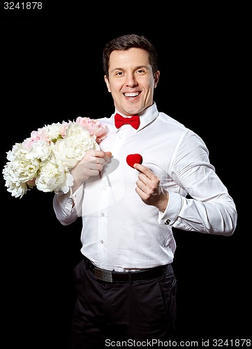 Image of The elegant man with a ring and flowers