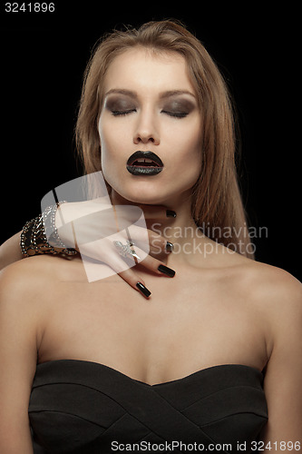 Image of Gothic woman with hand of vampire on her neck. Halloween