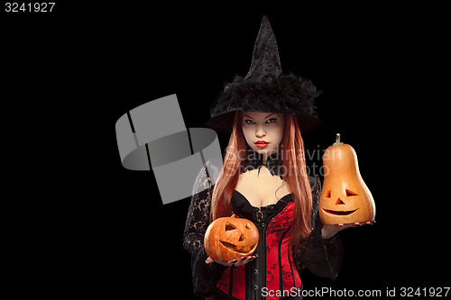 Image of Girl with Halloween pumpkin on black background