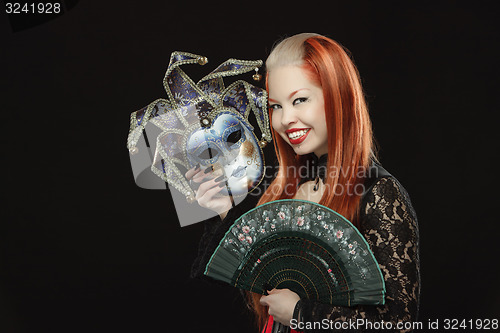 Image of Gothic girl with fan and a mask