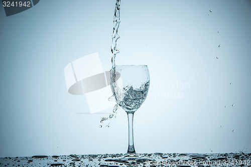 Image of glass being filled with water 