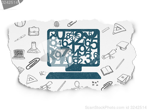 Image of Education concept: Computer Pc on Torn Paper background