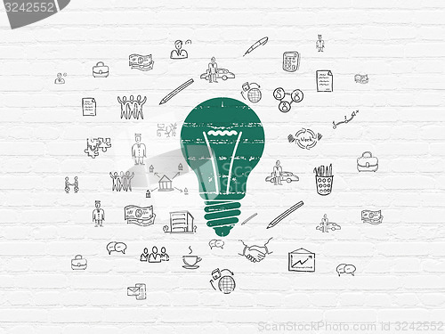 Image of Finance concept: Light Bulb on wall background