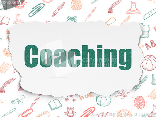 Image of Education concept: Coaching on Torn Paper background