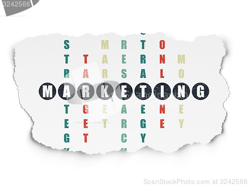 Image of Advertising concept: word Marketing in solving Crossword Puzzle