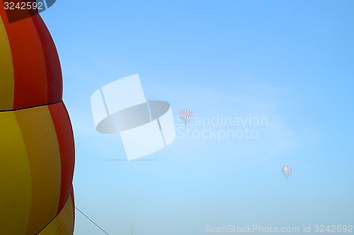 Image of hot air balloons in the morning fog