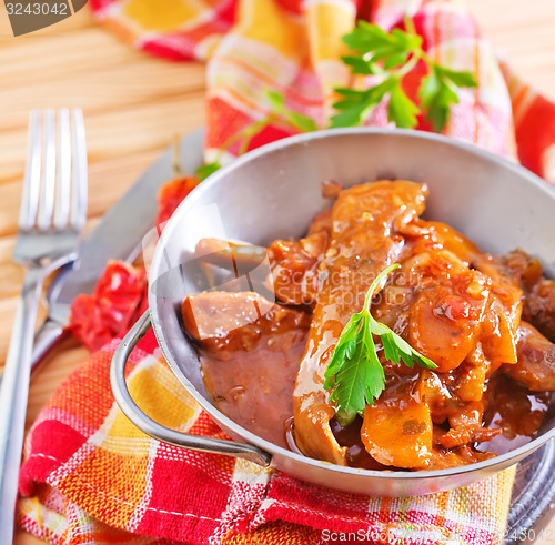 Image of fried meat with tomato sauce