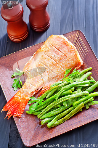 Image of fried fish with vegetables