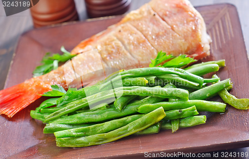 Image of fried fish with vegetables