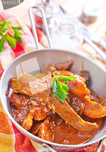 Image of fried meat with tomato sauce