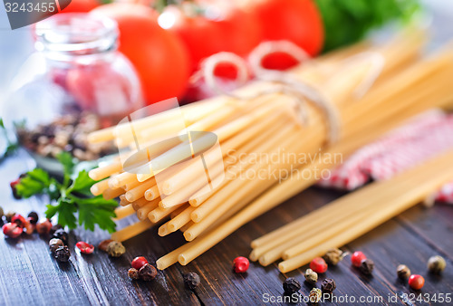 Image of raw pasta with tomato