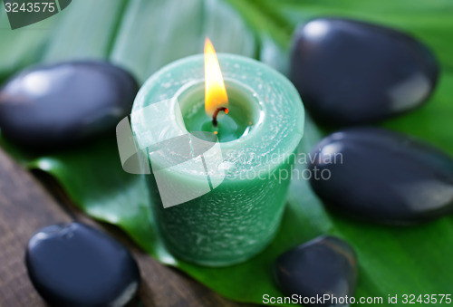 Image of candle and stones