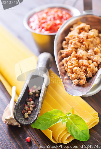 Image of dough for lasagna and ingredients for lasagna