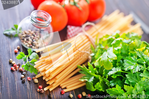 Image of raw pasta with tomato