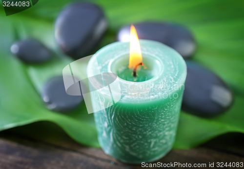 Image of candle and stones