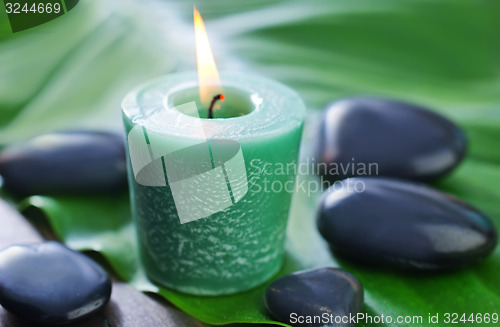 Image of candle and stones