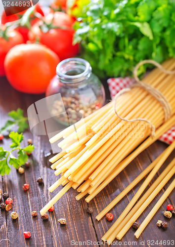 Image of raw pasta with tomato