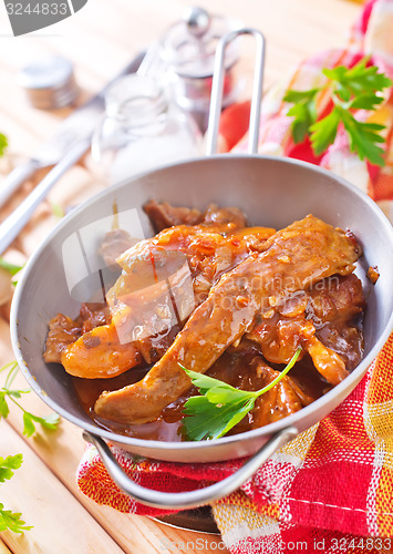 Image of fried meat with tomato sauce