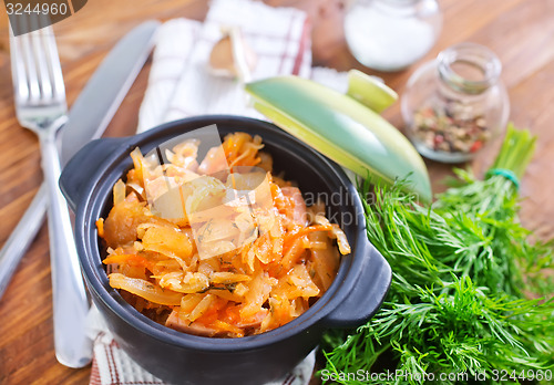 Image of fried cabbage with tomato sauce