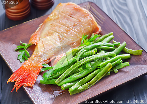 Image of fried fish with vegetables