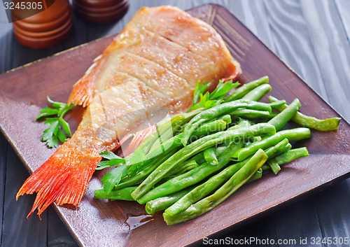 Image of fried fish with vegetables