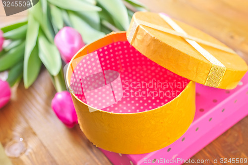 Image of present and tulips