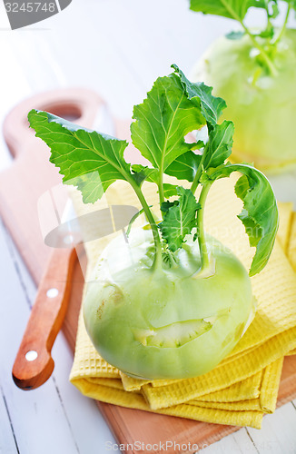 Image of Cabbage kohlrabi on Wooden Kitchen Board