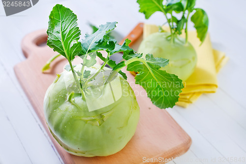 Image of Cabbage kohlrabi on Wooden Kitchen Board