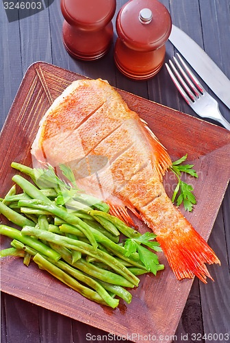 Image of fried fish with vegetables