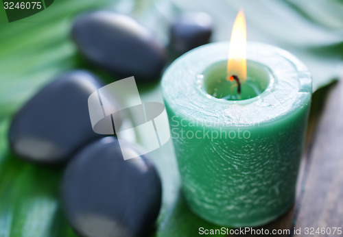 Image of candle and stones