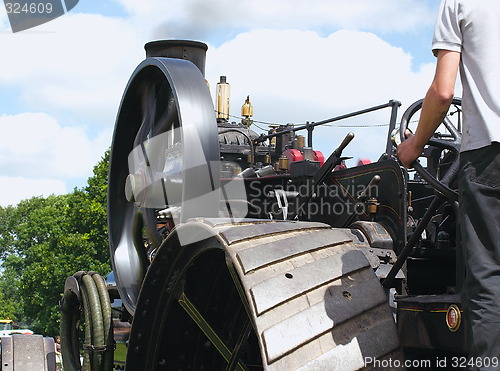 Image of traction engine wheels and driver