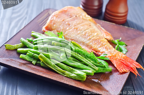 Image of fried fish with vegetables