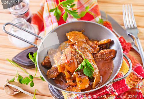 Image of fried meat with tomato sauce