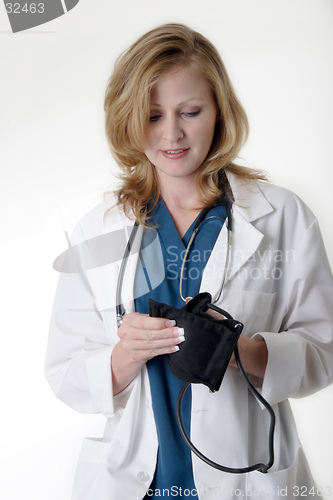Image of lady doctor holding blood pressure cuff