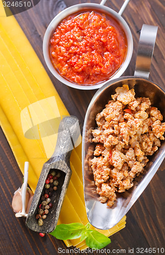 Image of dough for lasagna and ingredients for lasagna