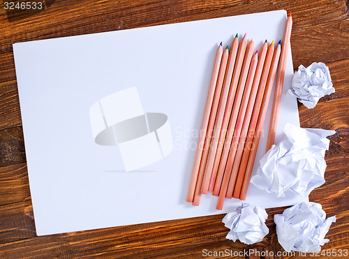 Image of paper on wooden background