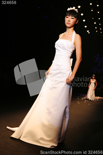 Image of Wedding dress model walking the catwalk at Seoul Collection (Fas