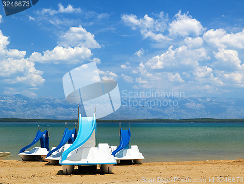 Image of Colorful pedalos on a beautiful tropical beach