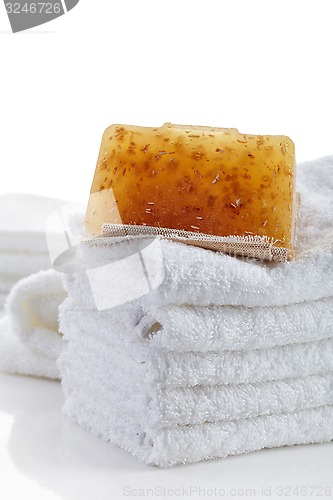 Image of stack of towels and natural soap bar