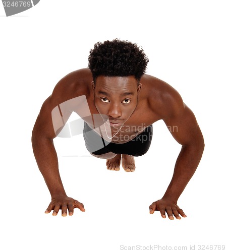 Image of Black man doing pushup\'s.