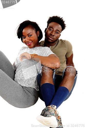 Image of Black couple sitting on floor.