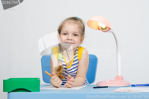 Image of Happy little girl drawing pencils