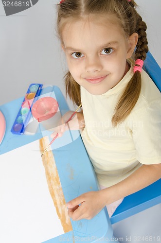 Image of The girl drew a picture on ground